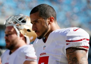 Colin Kaepernick of the San Francisco 49ers walks on the field during warm ups prior to the NFC Divisional Playoff Game against the Carolina Panthers on Jan. 12, 2014 in Charlotte, North Carolina. (Credit: Kevin C. Cox/Getty Images)