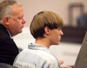 Dylann Roof, 21, listens to proceeding with assistant defense attorney William Maguire during a hearing at the Judicial Center July 16, 2015 in Charleston, South Carolina. (Credit: Randall Hill - Pool/Getty Images)