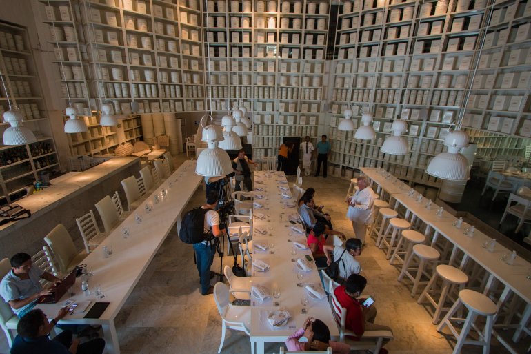 Journalists see inside the restaurant La Leche on Aug. 18, 2016, in Puerto Vallarta, Jalisco, western Mexico, from where Jesus Alfredo Guzman Salazar, son of drug lord Joaquin "El Chapo" Guzman, was kidnapped among others Monday. Seven gunmen in pickup trucks swooped on the upscale bar and restaurant Monday around dawn and abducted the victims. Investigators said it was likely part of a settling of scores between rival drug cartels. (Credit: HECTOR GUERRERO/AFP/Getty Images)