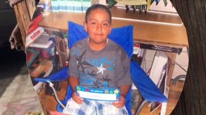 Jesse Romero is shown in a photo left Aug. 10, 2016, at the site where he was fatally shot by an LAPD officer the previous night. (Credit: Erin Myers / KTLA)