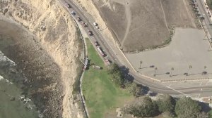 Los Angeles firefighters respond to Point Fermin Park, where a woman died after an apparently accidental fall from a cliff on Aug. 19, 2016. (Credit: KTLA)