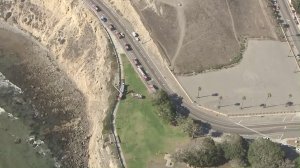 Los Angeles firefighters respond to Point Fermin Park, where a woman died after an apparently accidental fall from a cliff on Aug. 19, 2016. (Credit: KTLA)