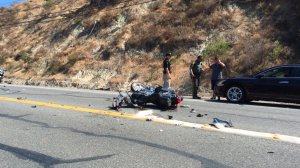 Officials investigate a fatal hit-and-run crash along Santiago Canyon Road in Modjeska Canyon on Aug. 1. (Orange County Fire Authority) 