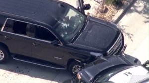Multiple gunshot holes are seen in an SUV that crashed into a police SUV, prompting an officer-involved shooting in Lawndale on Aug. 2, 2016. (Credit: KTLA)