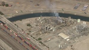 A plume rises above the Tesoro refinery after a breach in a sulfur tank there on Aug. 26, 2016. (Credit: KTLA)