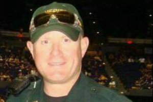 East Baton rouge Parish Sheriff's deputy Nicholas Tullier, 41, helped change a woman's flat tire night before he was shot on July 17, 2016. Tullier survived the attack that killed three other officers. (Credit: Gofundme)