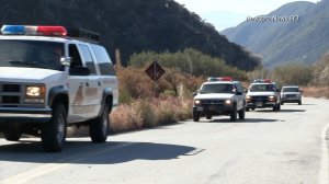 San Bernardino County sheriff's vehicles make their way toward the search area for Willie Norman on Aug. 15, 2016. (Credit: Newspro)