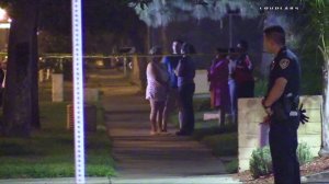 Spectators gathered near the scene of a fatal shooting that occurred behind a church in Riverside on Aug. 28, 2016 (Credit: LOUDLABS) 