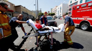 Los Angeles Fire Department personnel provide assistance to a woman believed to be feeling the effects of a synthetic cannabinoid called spice on Aug. 22, 2016. (Credit: Luis Sinco / Los Angeles Times)