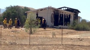 Authorities investigate after five people were found in a burned residence in the Temcula area on Aug. 29, 2016. (Credit: Michael J. Williams / The Press Enterprise)