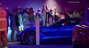 Several people line up against a wall after a shooting at Xposed Gentlemen's Club in Canoga Park on Aug. 20, 2016. (Credit: Loudlabs)