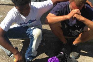 A photo of the teen giving his shoes to the homeless man was posted on a GoFundMe page.