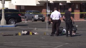 Police investigate a stabbing at a strip mall in Corona on Sept. 22, 2016. (Credit: KTLA)