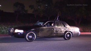 An old Crown Victoria that was stopped with two alleged police impersonators inside is shown on Sept. 6, 2016. (Credit: South Counties News)