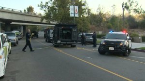 Authorities investigate after a Los Angeles Police vehicle was shot at on Sept. 11, 2016. (Credit: KTLA)