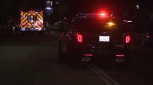 A police vehicle and Los Angeles Fire Department ambulance block the area where four people were shot in East Hollywood on Sept. 17, 2016. (Credit: KTLA)