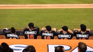 Miami Marlins players look on from the dugout wearing Jose Fernandez jerseys in honor of the late pitcher during the game against the New York Mets at Marlins Park on September 26, 2016 in Miami, Florida. (Credit: Rob Foldy/Getty Images)