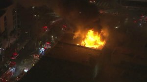 A fire destroyed a downtown Los Angeles smoking materials shop on Sept. 12, 2016. (Credit: KTLA)