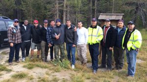 Javier Avelar and Dave Brown, embraced in center, are joined on Sept. 13 by colleagues who trekked to Yosemite to help find the pair. (Image courtesy of the Fullerton-Brea Fire Department)