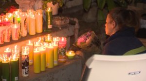 A vigil was held Sept. 25, 2016, at a Fullerton home where three people were found dead the previous day. (Credit: KTLA)