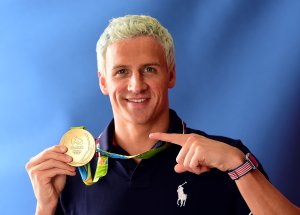 Swimmer, Ryan Lochte of the United States poses for a photo with his gold medal on the Today show set on Copacabana Beach on August 12, 2016 in Rio de Janeiro, Brazil. (Credit: Harry How/Getty Images)