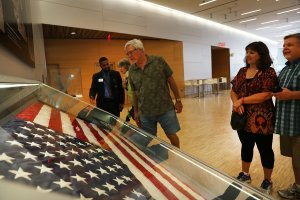 The American flag that was raised by firefighters above the site of the 9/11 attacks on the World Trade Center in New York on 2001 is displayed for the first time at the National September 11 Memorial & Museum after turning up in Washington state two years ago on September 8, 2016 in New York City. (Credit: Spencer Platt/Getty Images)