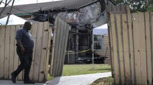 A law enforcement official walks near the scene of a fire at the Islamic Center of Fort Pierce which is the mosque that was attended by the Pulse nightclub gunman on September 12, 2016 in Fort Pierce, Florida. (Credit: Joe Raedle/Getty Images)