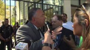 Sheriff's homicide Capt. Steven Katz responds as a man shouts at him outside a home where a man died after a police response on Sept. 30, 2016. (Credit: KTLA)