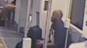 A man sought in the Aug. 6, 2016, fatal shooting of a mother and daughter is seen on a Blue Line train in video released by police.