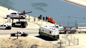Authorities pull a car from the California Aqueduct in the Littlerock area on Sept. 9, 2016. (Credit: KTLA)
