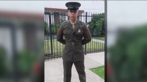 Carlos Segovia is shown in uniform in a family photo. 