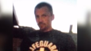 A man wanted in connection with battery on an autistic teen is seen in a blurry photo released from the Newport Beach Police Department on Sept. 24, 2016.