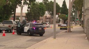 Officials investigate the scene in Rosemead where a man allegedly stole a parking enforcement vehicle and later died on Sept. 12, 2016. (Credit: KTLA) 