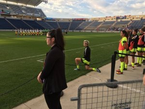 US soccer international and Seattle Reign midfielder Megan Rapinoe knelt during the national anthem before her team's clash with the Chicago Red Stars in a show of solidarity with San Francisco 49ers' quarterback Colin Kaepernick. (Credit: Gbpackfan32/Twitter)