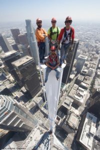 Construction workers pose in a photo from atop a spire 1,099 feet above the ground in downtown L.A. on Sept. 3, 2016. (Credit: Gary Leonard/Wilshire Grand)