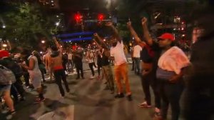 Protesters marched through downtown Charlotte on Wednesday afternoon to protest the fatal shooting of Keith Lamont Scott, who was shot and killed by a Charlotte-Mecklenburg Police Officer on Tuesday. (Credit: CNN)