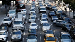 The new law will explicitly prohibit people from using a mobile phone while driving unless the device is in a hands-free mode. In addition to texting and calling, it aims to prohibit other cellphone uses while driving, such as taking photos or streaming video. (Credit:Luis Sinco / Los Angeles Times)