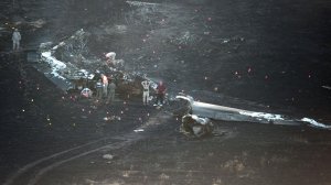 Members of the military investigate the site where an Air Force U-2 crashed in Sutter, California on September 20, 2016. A US pilot was killed and another injured after they ejected from a U-2 spy plane on a training mission in rural California, the Air Force said. (Credit: Josh Edelson/AFP/Getty Images)