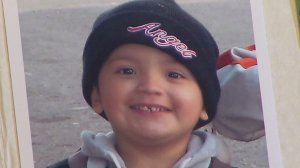 Yonatan Daniel Aguilar, 11, is seen in a family photo album shown at his public memorial on Sept. 14, 2016 in Echo Park. (Credit: KTLA)