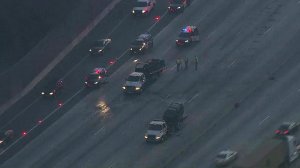 Crews respond to a fatal crash on the 10 Freeway in Montclair on Oct. 13, 2016. (Credit: KTLA)