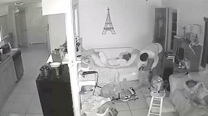 Surveillance video released by the Brevard County Sheriff's Office shows a burglar inside a home as victims sleep nearby. 