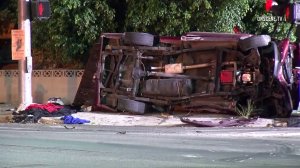 A red pick up truck remains on its side at the scene of a double fatal hit-and-run crash in Chatsworth on Oct. 7, 2016. (Credit: OnScene.TV) 