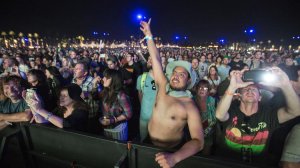 Fans cheer as the Rolling Stones take the stage at Desert Trip in Indio on Friday. (Brian van der Brug / Los Angeles Times)