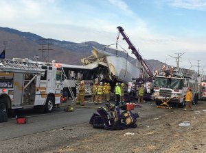 Authorities respond to a deadly crash between a big rig and a tour bus on Oct. 23, 2016 in Desert Hot Springs. (Credit: Chris Tarpening/KESQ)