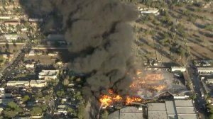 Smoke billows from a huge fire in Ontario on Oct. 21, 2016. (Credit: KTLA)