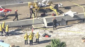 Los Angeles firefighters surround a well that construction worker fell into in Bel-Air on Oct. 21, 2016. (Credit: KTLA)