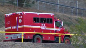 Fire crews are seen heading to a brush fire near Porter Ranch on Oct. 19, 2016. (Credit: KTLA)