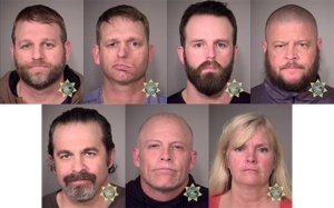 In this composite with handout images provided by the Multnomah County Sheriff's Office, top, left to right, Ammon Bundy, Ryan Bundy, Ryan Waylen Payne, Brian Cavalier, and bottom left to right, Peter Santilli, Joseph Donald OShaughnessy, and Shawna Cox pose for booking photos after being arrested by U.S. Marshalls Jan. 26, 2016 in Oregon. 