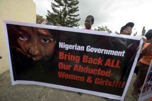 Members of Bring Back Our Girls movement carries banner to press for the release of the missing Chibok schoolgirls in Lagos, on April 14, 2016. (Credit: PIUS UTOMI EKPEI/AFP/Getty Images)