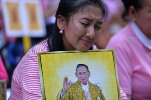 Supporters of Thailand's King Bhumibol Adulyadej react as they pray at Siriraj Hospital, where the king is being treated in Bangkok on October 13, 2016. (Credit: MUNIR UZ ZAMAN/AFP/Getty Images)